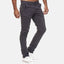 Ein Mann präsentiert eine Elara Slim Fit Chino-Hose in Dunkelgrau mit weißen Sneakers vor einem schlichten weißen Hintergrund; nur sein Unterkörper und seine Beine sind sichtbar, wodurch der Fokus auf Stil und Tragekomfort liegt.